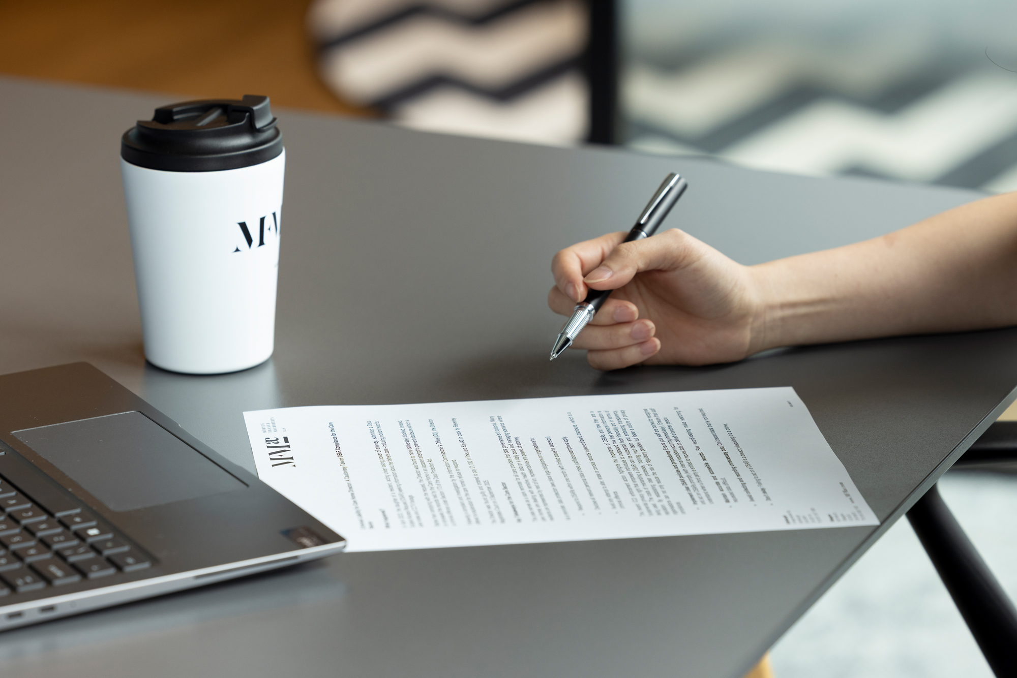 A professional image of a person reviewing immigration documents or visa paperwork alongside a passport.